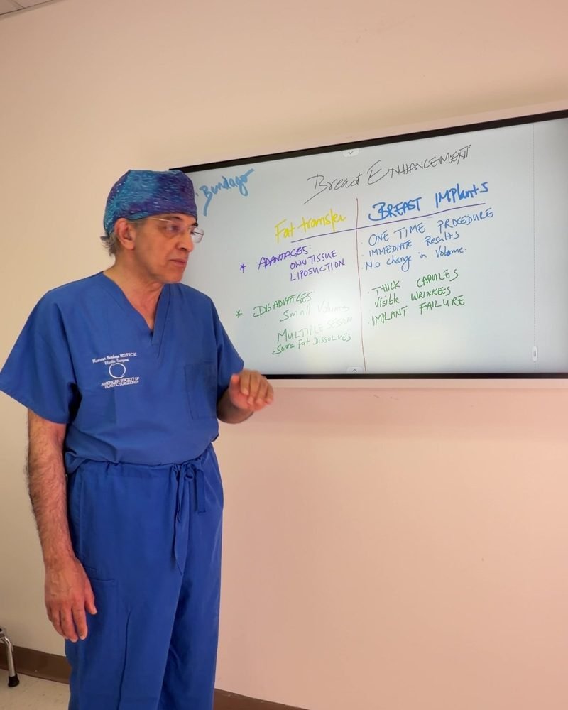 Dr. Bendago walking through a surgical plan at the whiteboard